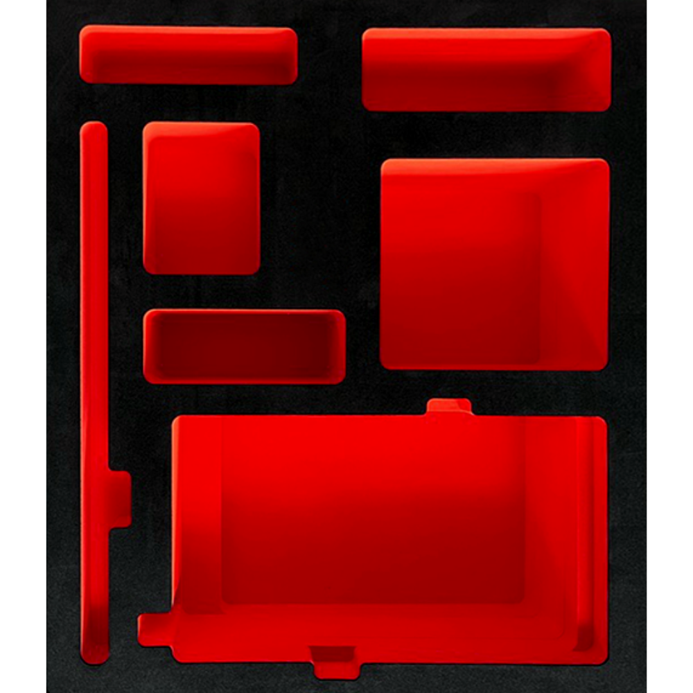 Red foam inserts shaped like various small items, including rectangular and square shapes, in a black background.