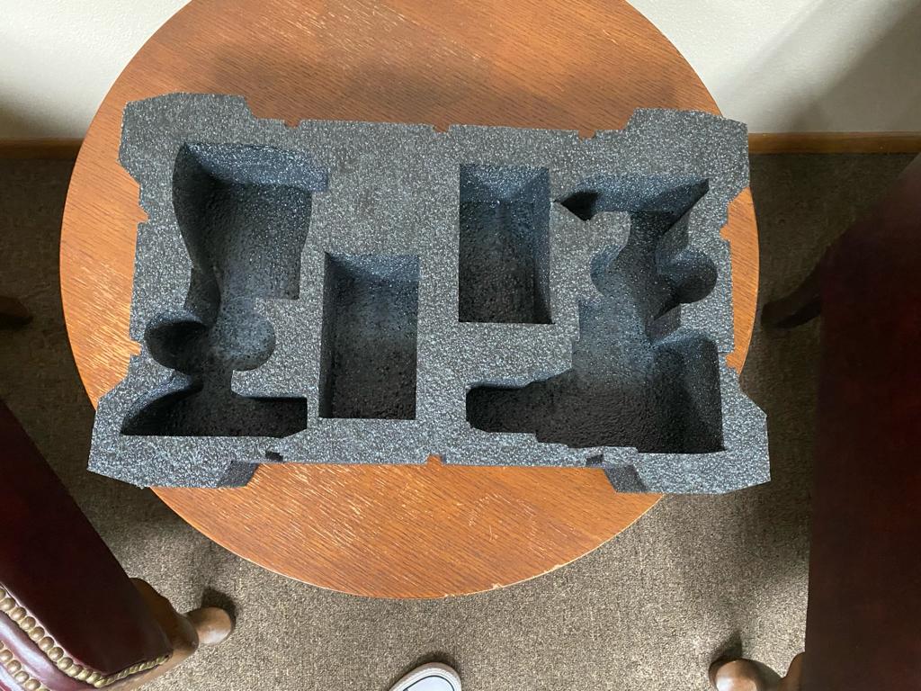 Custom Foam Parts - gray custom foam insert with precision-cut cavities for product protection